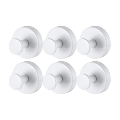 Six white door knobs on a white background